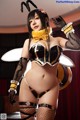 A woman dressed as a bee in a black and yellow outfit.