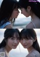 A couple of young women standing next to each other on a beach.